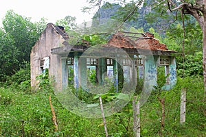 Abandoned ruin house overgrown jungle, Phong Nha, Vietnam photo