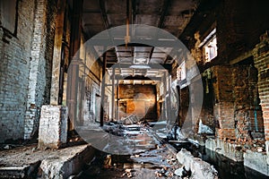 Abandoned ruined industrial factory building, corridor view with perspective, ruins and demolition concept