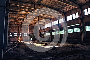 Abandoned ruined industrial factory building, corridor view with perspective, ruins and demolition concept