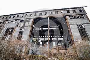 Abandoned ruined industrial factory building, ruins and demolition concept