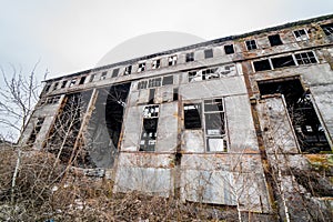 Abandoned ruined industrial factory building, ruins and demolition concept