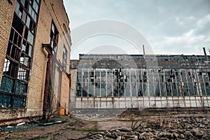 Abandoned ruined industrial factory building, ruins and demolition concept