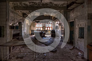 Abandoned and ruined kitchen of closed factory canteen or restaurant