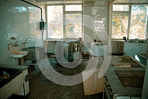 Abandoned and ruined kitchen of closed factory canteen or restaurant