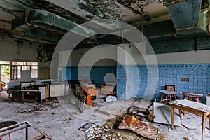 Abandoned and ruined kitchen of closed factory canteen or restaurant