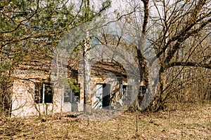 Abandoned Ruined Old Village House In Chernobyl Resettlement Zone. Belarus. Chornobyl Catastrophe Disasters. Dilapidated