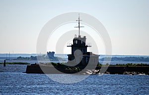 Abandoned ruins of a building on an island at the entrance to the Bay. The merchant Harbor. City Of Kronstadt.