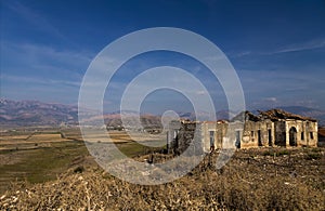 Abandoned ruins of rural house in South Albania in autumn time. Vlora district, not far from Saranda