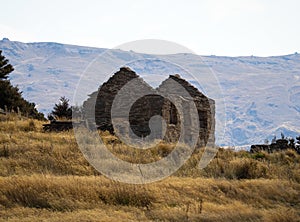 Abandoned run-down house ruins brick stone walls of goldmining settlement Welshtown Bendigo in Central Otago New Zealand