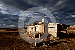 Abandoned rural house landscape dramatic cloud sky