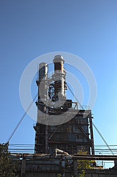 Abandoned and rusty chemical factory chimneys