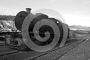 abandoned rusty locomotive on a track