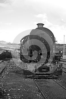 abandoned rusty locomotive on a track