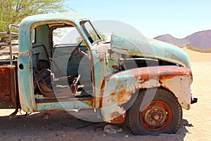 Abandoned rusty pickup car in desert, Africa