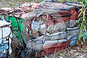 Abandoned rusty pressed piece of car