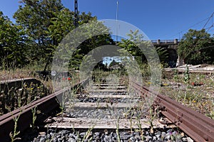 Abandoned and rusty railway going nowhere photo