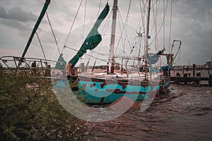 Abandoned sailboat ship wrecked on a Texas lake
