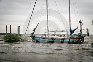 Abandoned sailboat ship wrecked on a Texas lake