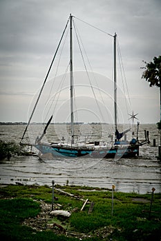 Abandoned sailboat ship wrecked on a Texas lake