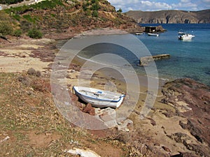 Abandoned sailing boat on a beach in Mikanos, Greece