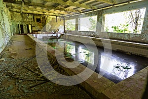 Abandoned school swimming pool in ghost town Pripyat Chornobyl Zone photo