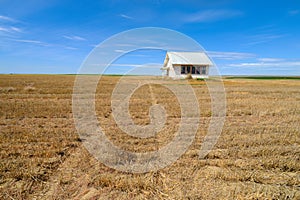 An abandoned schoolhouse in a farm field, southeastern Washington, USA