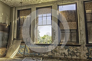 Abandoned Schoolroom With Large Windows photo