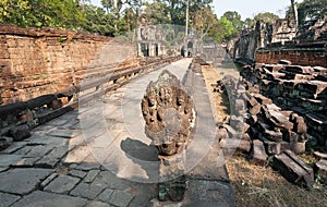 Abandoned sculptures and walls of the 12th century Preah Khan temple, Cambodia. Historical ruins in forest in Angkor