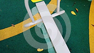 Abandoned see saw. Illustration of a sad empty playground. Top view
