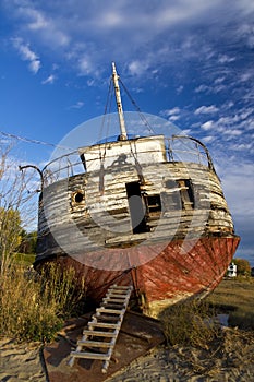 Abandoned shipwreck ashore photo