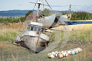 Abandoned shipwreck in a boat graveyard in Homer Spit Alaska