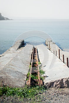 Abandoned Shipyard with Rusty Iron and Overgrown Weeds