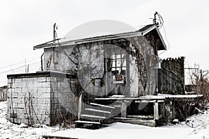 Abandoned snow covered electrical shack - Worn, Broken and Forgotten I