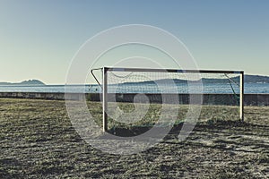 abandoned soccer goal near the sea