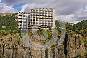 Abandoned soviet hotel on the cliff of Arpa river canyon on spa