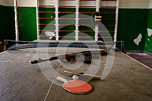 An abandoned sports hall at the school, sports equipment destroyed by time.