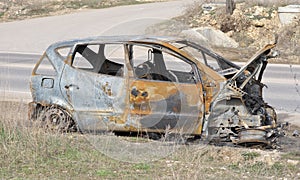 Body of the burnt car in the street photo