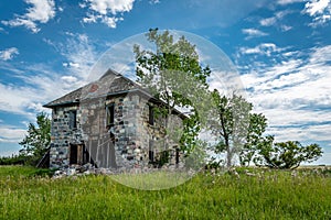 An abandoned stone house on the Saskatchewan prairies outside Abernethy, SK