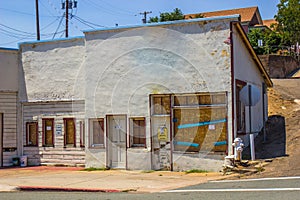 Abandoned Store Front With Boarded Up Windows