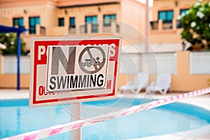 Abandoned swimming pool at the time of epidemic. Health measures. No swimming sign.Pool under closure. Consequences of self