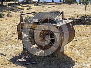 Abandoned thresher in the field