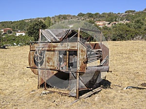 Abandoned thresher in the field