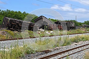 Abandoned train carriages near the tracks at Addo Elephant National Park on South Africa