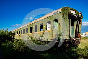 Abandoned train. Forgotten overgrown railway. Old rusty railway carriage