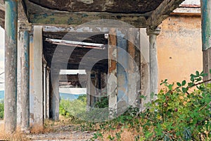 Abandoned train station building with column