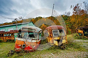 Abandoned Trolley Cars in Fall