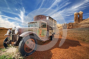 Abandoned truck in a rocky desert landscape