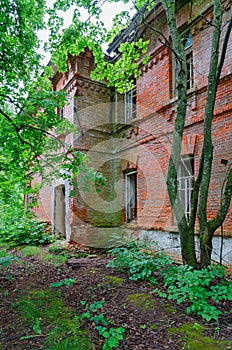 Abandoned two-story brick school building in resettled village of Babchin in exclusion zone of Chernobyl nuclear power plant