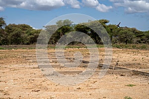 Abandoned and unkept parking lot for safari vehicles in Tarangire National Park in Tanzania photo