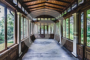 Abandoned veranda view through conservatory